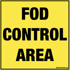 Yellow square FOD Control Area sign with black text, indicating designated debris management zone.