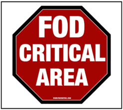 Red octagonal FOD Critical Area sign, white text warning to prevent foreign object debris hazards.