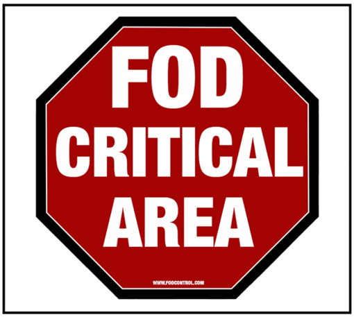 Red octagonal FOD Critical Area sign, white text warning to prevent foreign object debris hazards.